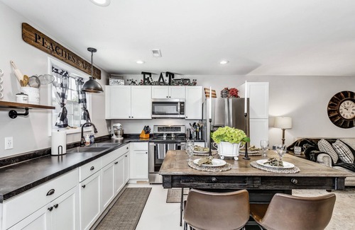 Wichita House | Front door parking, private covered patio with fenced in backyard