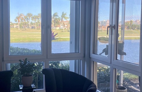 St. David's Island House | Gated Grand Harbor Townhome with beautiful views of the golf course and water