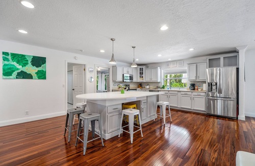 North Palm Beach House | Gorgeous Beach House Open Floor Plan, Heated Extra Large Pool & Office