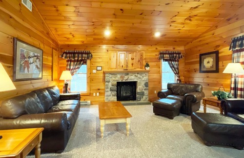 Reeders Cabin | Gorgeous log cabin has a Big stone fireplace and a beautiful view of the lake