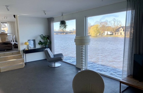 Amsterdam East Boat Rental | Grand luxury water villa on Amstel river