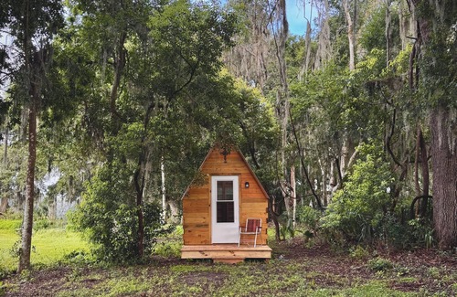 Reddick Cabin | Grass Campers whimsical 1 room Glamping Forest Hideaway Sugar Shanty near WEC
