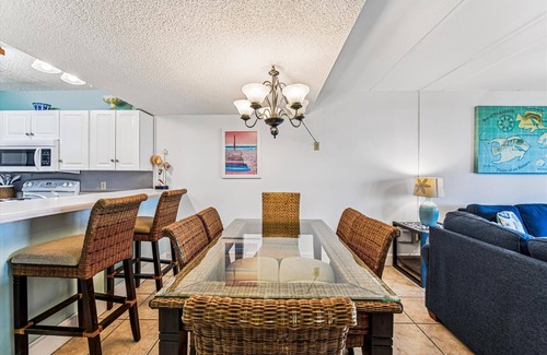 St. George Island Condo | HEAR THE ROAR of the ocean and the slow flapping of the blue herons.