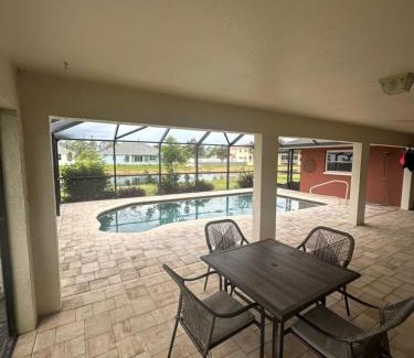 Pebble Beach House | Heated pool with canal views