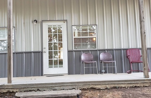 Sulphur House | Henson 2: Rustic 2 Bedroom Cabin surrounded by trees.