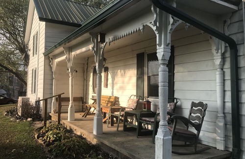 Carlisle House | Hilltop Farmhouse with sunrise sunset porch overlooking hills and holler