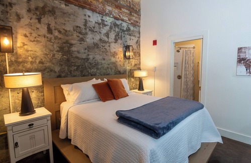 Bywater Bed & Breakfast | Historic Firehouse in the French Quarter! Queen suite with private bathroom.