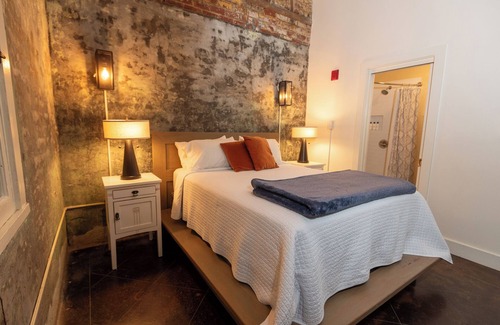 Bywater Bed & Breakfast | Historic Firehouse in the French Quarter! Queen suite with private bathroom.