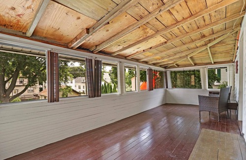 Racine House | Historic house on tree lined red brick street of historic homes.