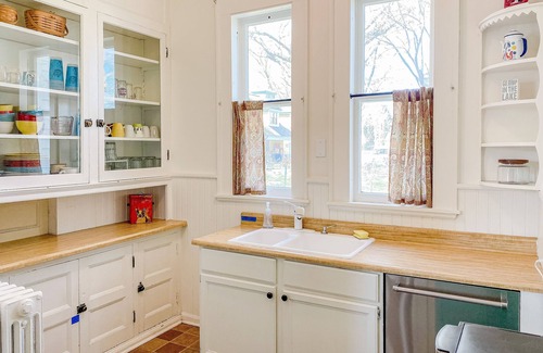Manistee House | Historical dog-friendly home with fenced yard, grill, Ping-Pong, fireplace, & AC