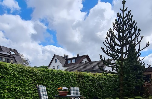 Balve Apartment | Holiday Apartment 'Zum Plauderbaum' with Private Terrace, Private Garden and Private Outdoor Whirlpool