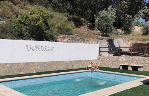 Villanueva de Algaidas House | Holiday Home 'Casa La Pedriza Para 8' with Mountain View, Shared Pool and Wi-Fi