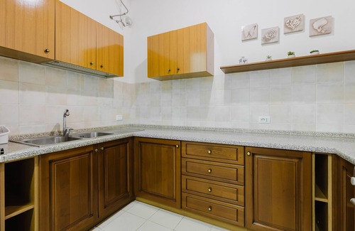 Palmas Arborea House | Holiday Home 'Il Corbezzolo Apartment' with Shared Terrace, Wi-Fi and Air Conditioning