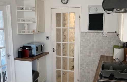 Earnley Ski Chalet | Home from home, for families, couples and pets. Inc heated pool, pub, crazy golf