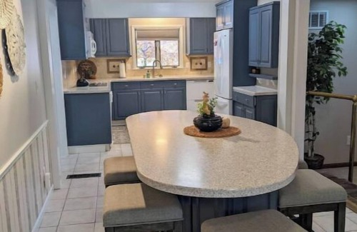 Manhattan House | Hot Tub and Game room! Center of Town, walking distance to ball games & College.