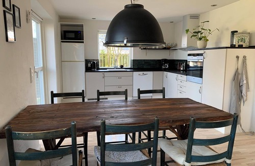 Rageleje House | In the charming coastal town of Rågeleje, this lovely holiday home is located.