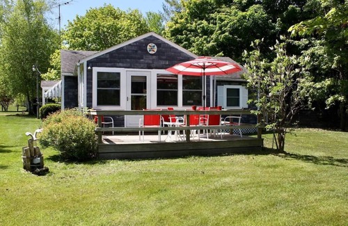 Lake Leelanau Cottage | In the narrows on Lake Leelanau, pet friendly, sleeps 8, and a dock!