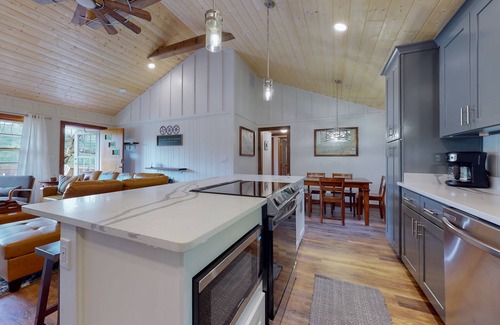 Penrose House | Inviting home with game room, firepit, full kitchen, central AC, & W/D