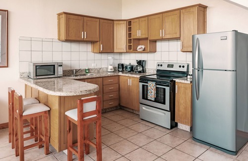 Playa Hermosa Apartment | Inviting ocean-view condo near the beach with pools, scenic balcony, & WiFi