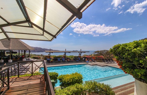 Playa Hermosa Apartment | Inviting ocean-view condo near the beach with pools, scenic balcony, & WiFi