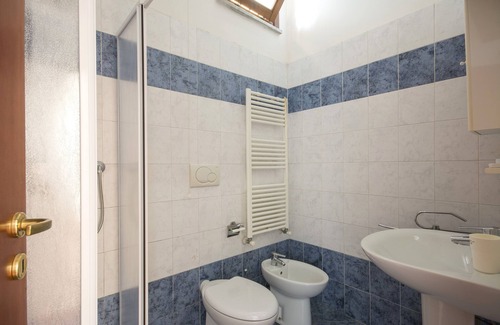 Pisa Apartment | JOIVY Red Terraced Apartment