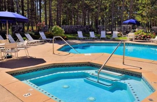 Harbor Springs Condo | Kitchen, Stone Fireplace, Jacuzzi. Trout Creek Condo #82 - 2 Bedrooms 2 Baths. Pools, Tennis, Hiking