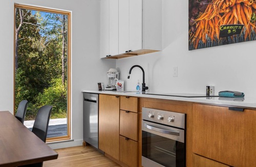 Acme House | KOTI 5 (Two Bedroom) Traverse City's Scandinavian Cabins, vacation home on TART & mins to Traverse C