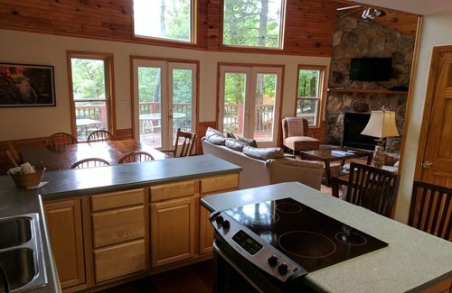 Zoe Cabin | Lake Cabin in beautiful wooded setting overlooking crystal clear lake.