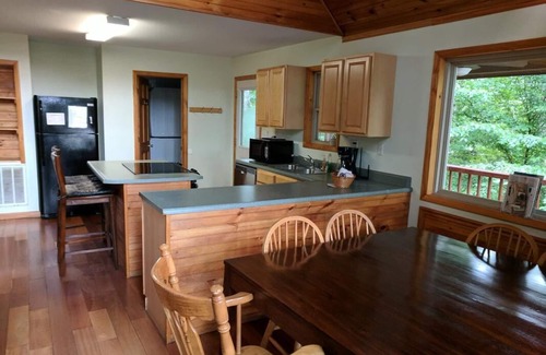 Zoe Cabin | Lake Cabin in beautiful wooded setting overlooking crystal clear lake.