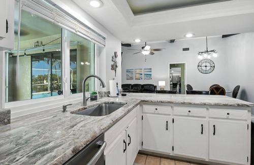 Fort Myers House | Lake Front Oasis in Cape Coral with Pool, Kayaks, and Scenic View
