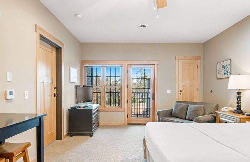 Three Lakes Condo | Lake-view condo with fireplace, loft, washer/dryer, pools, hot tubs, & firepit