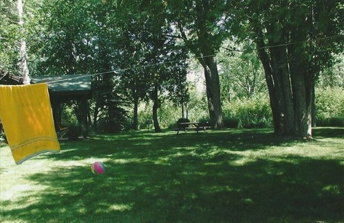 Cheboygan Cabin | Lakefront Cottage - Beautiful Grounds and Large Sandy Beach