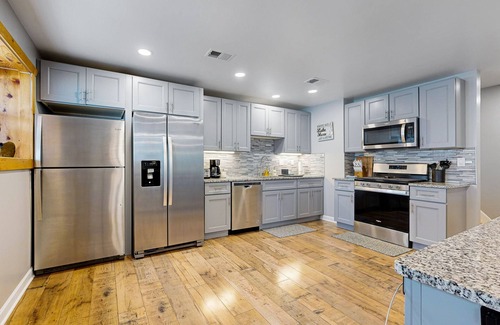 Channel Lake House | Lakefront home with firepit, 2 kitchens, & 2 W/Ds