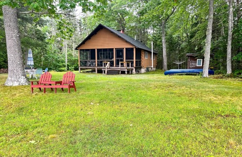Mariaville Cabin | Lakefront home with stunning views, firepit, 2 canoes, fast WiFi & yard games