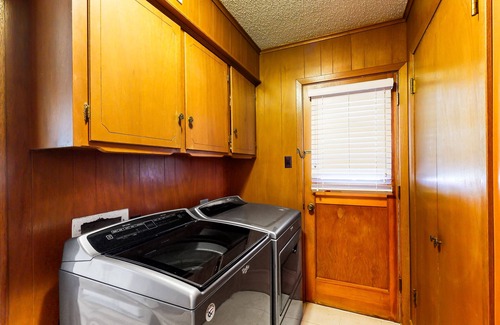 Kemp House | Lakefront retreat near golf course with serene wraparound deck, fireplace, & AC