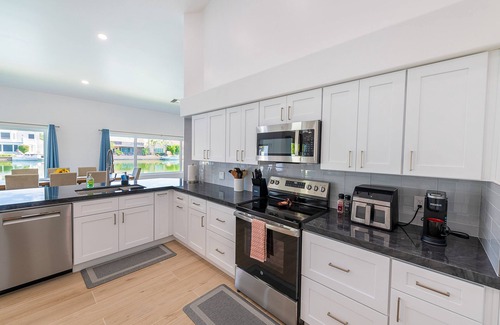 Val Vista Lakes House | Lakeside Luxe: Private Home in Gated Community with Heated Pool, Spa and More!