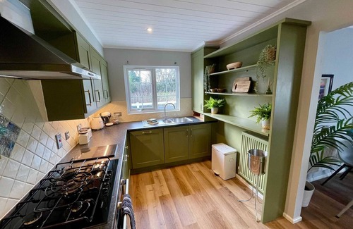Ampney Crucis House | Lakeside Windrush Turret Lodge with Hot Tub Family Friendly On-site Facilities