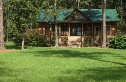 Gilbert House | Large Log Cottage: Green Grass, Blue Skies, Lake Living