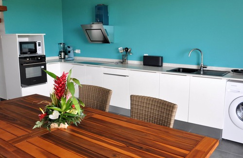 Le Moule Apartment | Lavender apartment, 3 air-conditioned bedrooms, and landscaped swimming pool