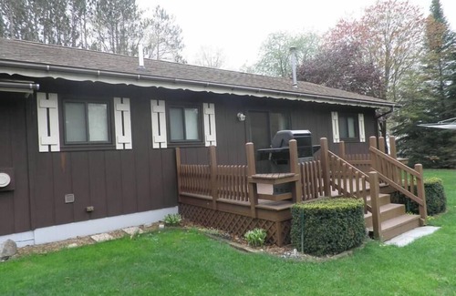Cadillac House | Lazy Acorn "The Yellow Perch" on Lake Mitchell