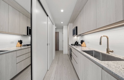 West Loop Hotel | Level - Fulton Market Junior Two Bedroom Two Bath suite with kitchen and balcony