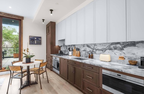 Bowery Apartment | Library Loft by StayHaus | 2BR Full-Service Condo with Terrace