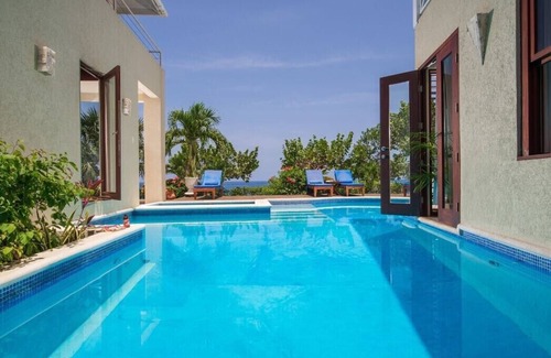 Orange Bay Villa | Little Waters 4-WATERFRONT BALINESE STYLE! POOL! STAFF! SUNSETS!
