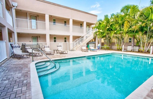 Pass-a-Grille Historic District Condo | Located on Historic Pass-A-Grille Beach. Steps to Sand, Heated Pool, Near Food and Free Parking!