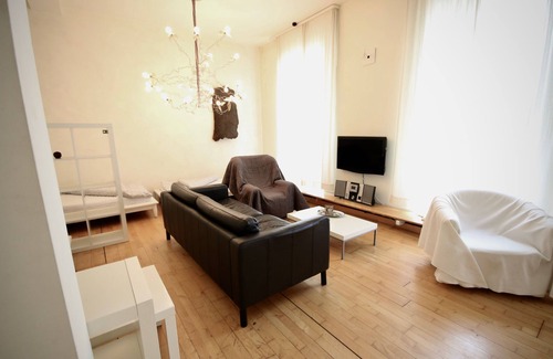 Oberhausen Apartment | Loft with parquet and designer lights by Ingo Maurer - attractive and stylish