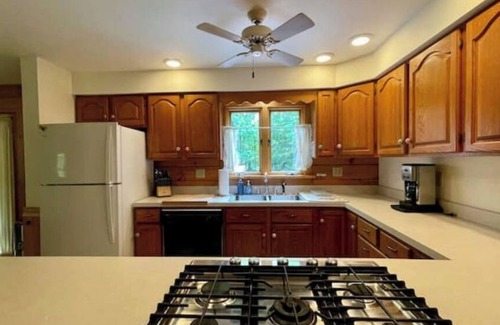 Riverside Estates Cabin | Log Cabin w/ Full Garage, FirePit, BBQ, cozy gas heat Stove