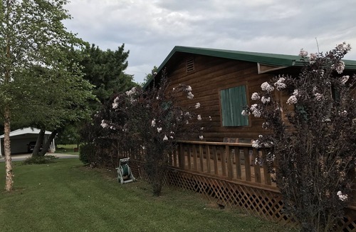 Longtown House | Log Cabin Wrap Around Deck with Lake View
