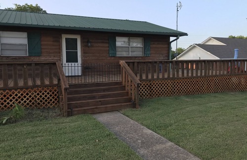 Longtown House | Log Cabin Wrap Around Deck with Lake View