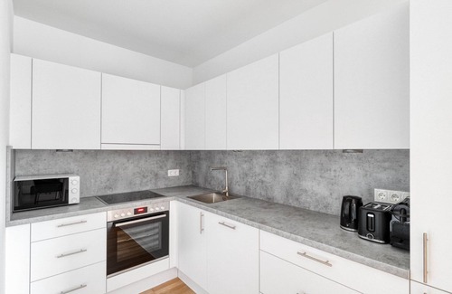 Vienna Apartment | Luxe Marinatower 2BR w/Gym & Elevator, nr metro U2, by Blueground