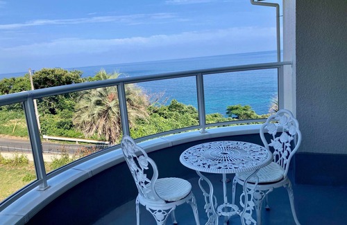 Hamada House | Luxrious double room with mountain view and ocean view from the balcony and an interior window/Hamada Shimane